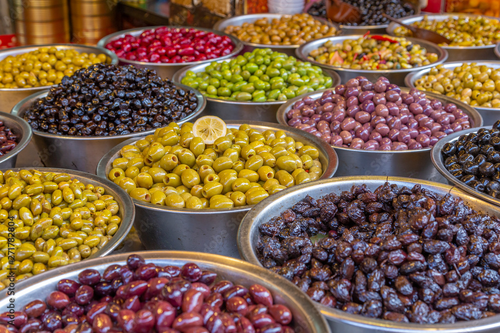 View of olives and beans on stall in Had veHalak Market on Ha Carmel Street, Tel Aviv, Israel